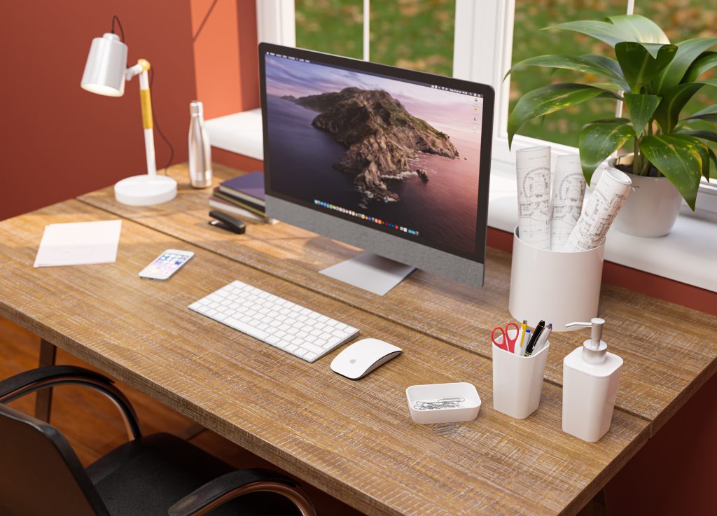 Uma escrivaninha marrom com um Macbook e alguns porta-objetos da linha Office da Astra aparecem na imagem.