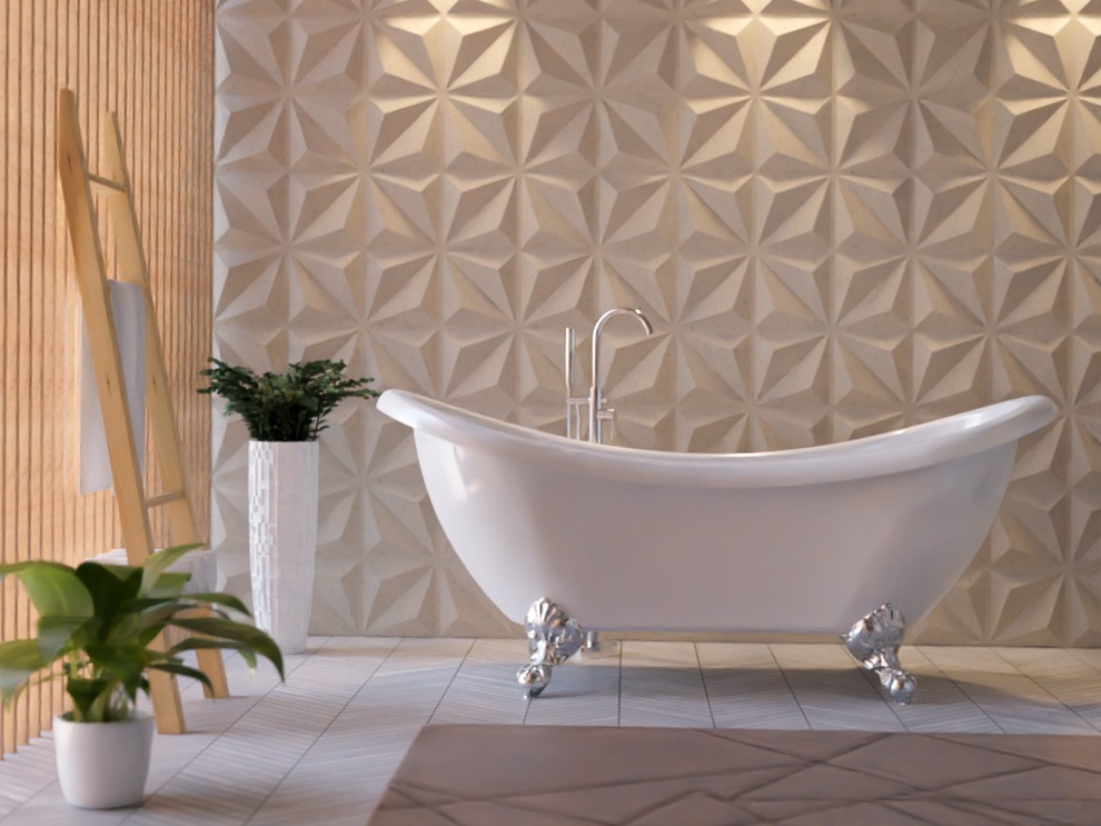 Uma banheira de imersão branca, com curvas e pés prateados, aparece em um cômodo que possui revestimento 3D em formato de origami. 
